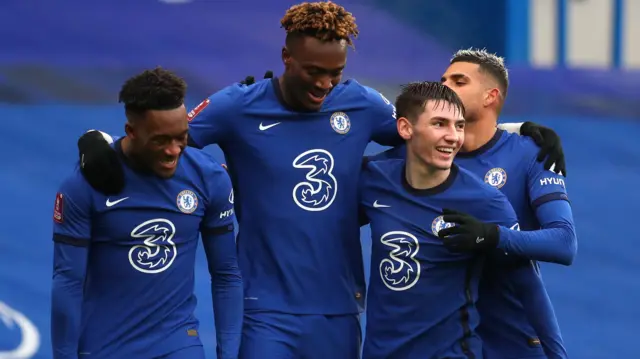 Tammy Abraham (centre) celebrates with Callum Hudson-Odoi and Billy Gilmour