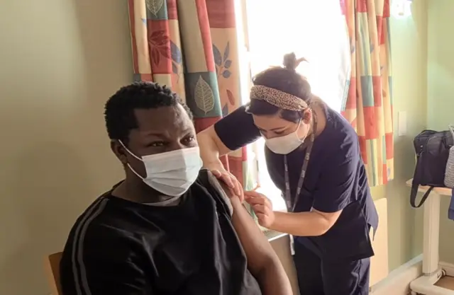 A resident getting a vaccine at Brocklehurst Nursing Home in West Didsbury