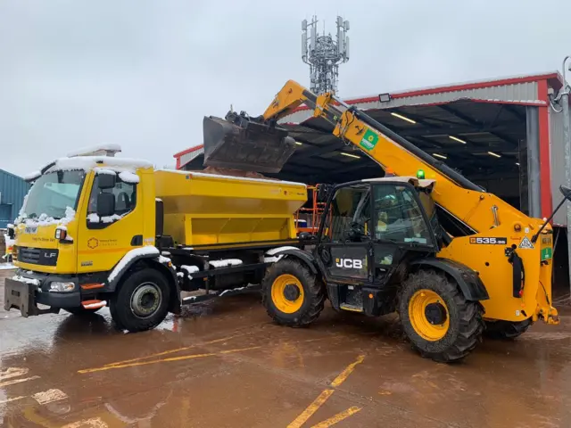 A gritter being loaded