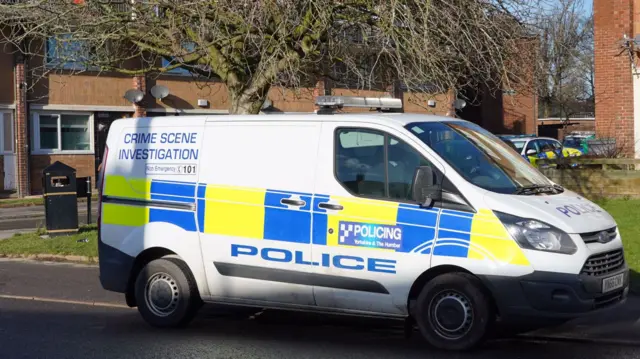 A CSI van outside a flat