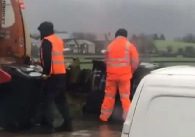 Binman urinating