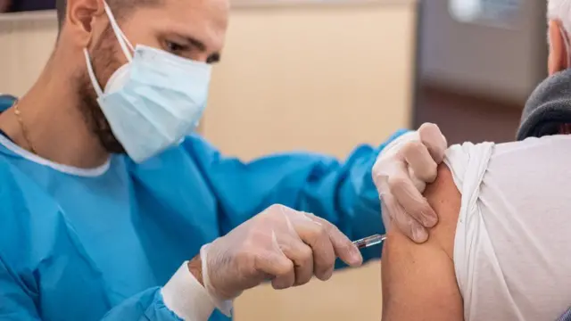 A man receiving a vaccine