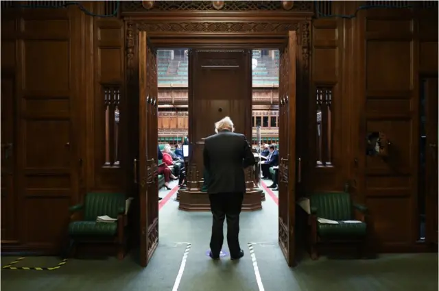 Boris Johnson walking in to Prime Minister's Questions