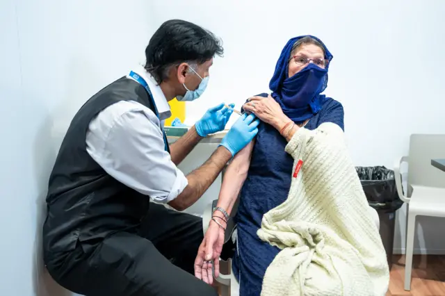 Woman being vaccinated