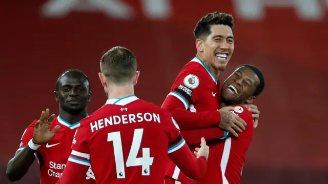 Liverpool celebrate scoring against Tottenham in December