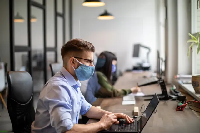 Office worker wearing mask