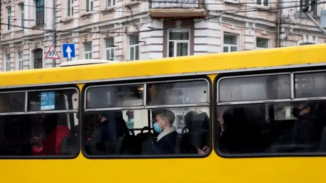 A passenger wearing a protective face mask is seen on a bus amid the coronavirus disease pandemic in central Kyiv, Ukraine, on 27 January 2021