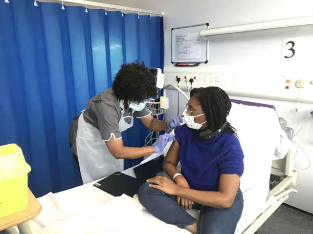 Equalities Minister Kemi Badenoch receiving the Novavax vaccine