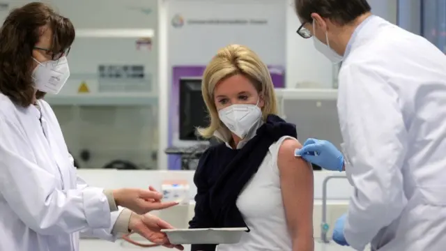 A woman being vaccinated