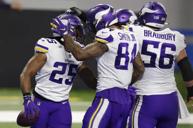 Alexander Mattison celebrates a touchdown