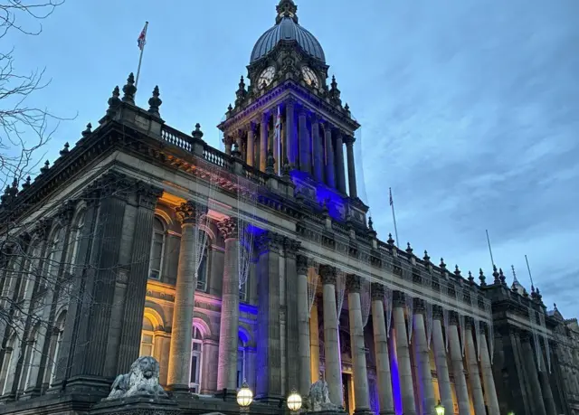 Building in Leeds lit up blue