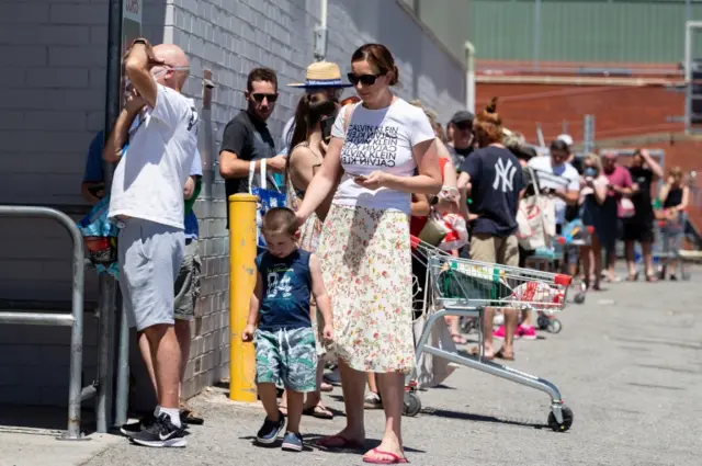 People queue outside a supermarket in Perth, Australia, on 31 January 2021