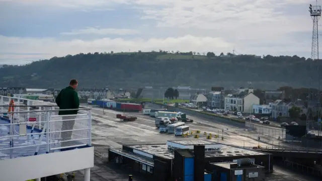 Man overlooking a port in Northern Ireland