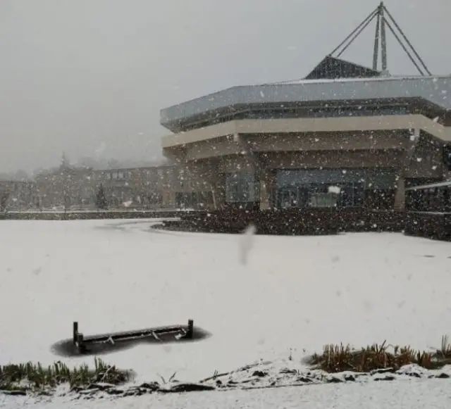 Lake at University of York frozen and covered in snow