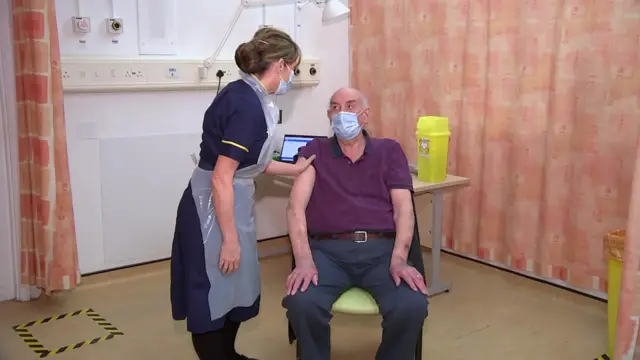 Brian Pinker getting the Oxford vaccine