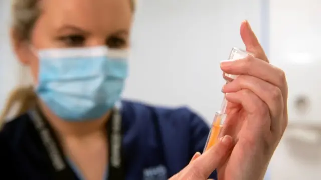 Nurse with vaccine