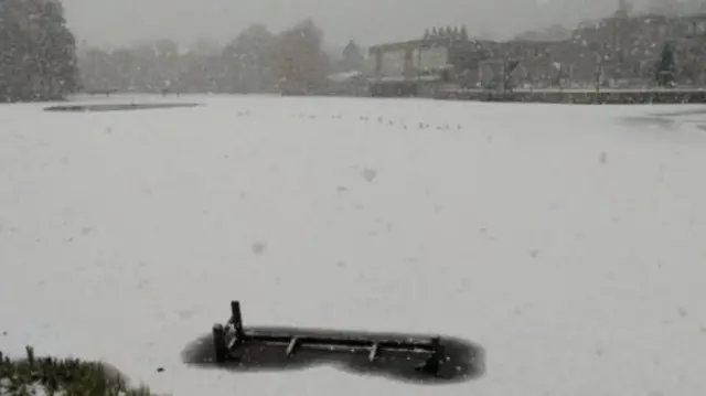 Lake at University of York frozen and covered in snow