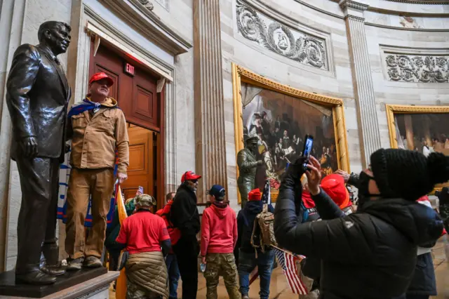 Supporters of US President Donald Trump enter the US Capitol's Rotundaa on January 6, 2021, in Washington, DC