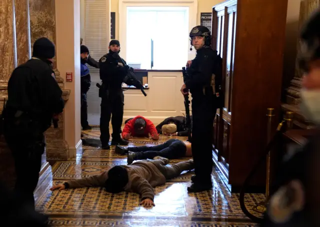 Capitol Police stand detain protesters outside of the House Chamber during a joint session of Congress on January 06, 2021 in Washington, DC