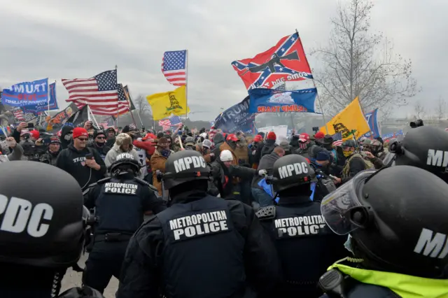 Trump supporters clash with police and security forces as they storm the US Capitol in Washington D.C on January 6, 2021