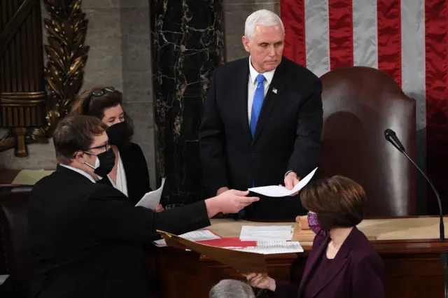 US Vice-President Mike Pence (C) presides over a joint session of Congress to count the electoral votes for President at the US Capitol in Washington