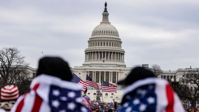 Protesters stand outside the US Capitol