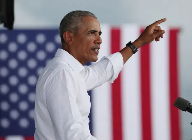 Former President Barack Obama speaks in support of Democratic presidential nominee Joe Biden during a drive-in rally  in North Miami, Florida.