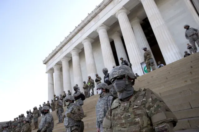 Members of the D.C. National Guard stand on the steps of the Lincoln Memorial in June