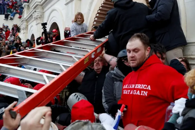 Trump supporters try to enter the Congress building