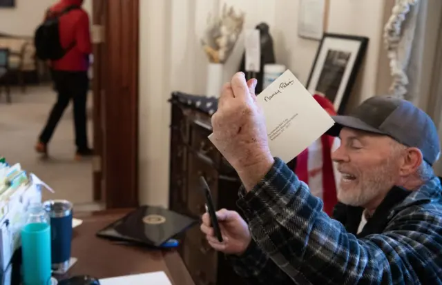 A rioter who broke into Pelosi's office brandishing her letters before leaving the building