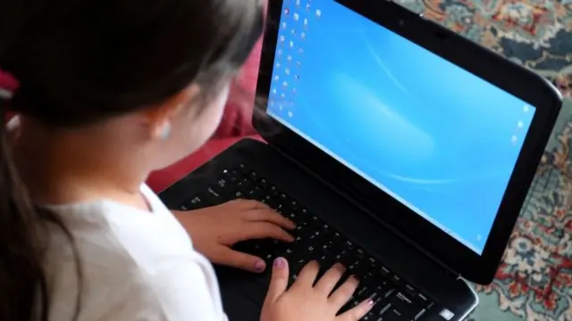 Child using laptop