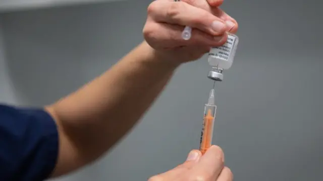 A vaccine jab being prepared