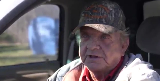 Sonny Brown sits in his car