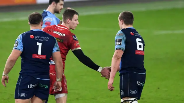 Liam Williams and Shane Lewis-Hughes shake hands