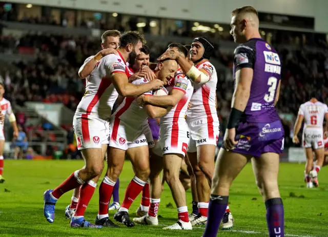 St Helens celebrate James Roby's try