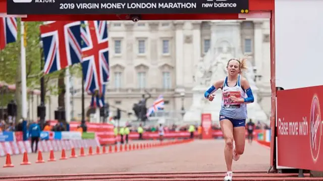 Charlotte Purdue crosses the London Marathon finish line