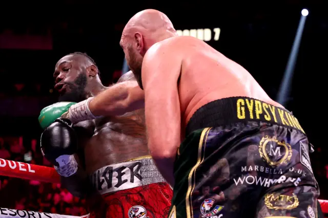 Tyson Fury lands a punch on Deontay Wilder