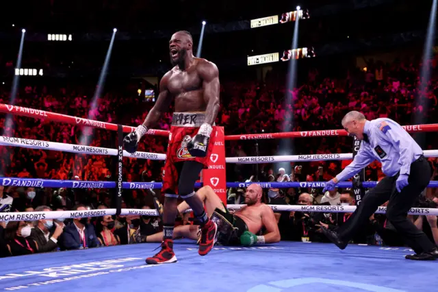 Deontay Wilder knocks down Tyson Fury for the first time