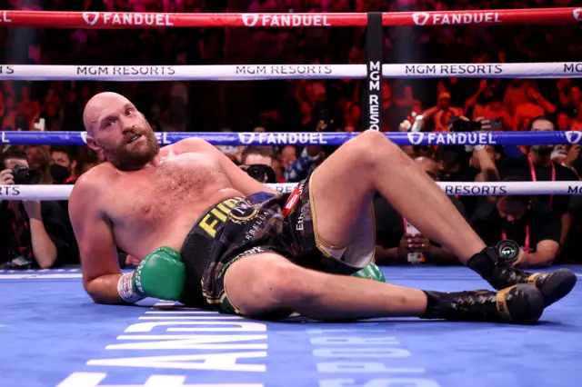 Tyson Fury is knocked down by Deontay Wilder