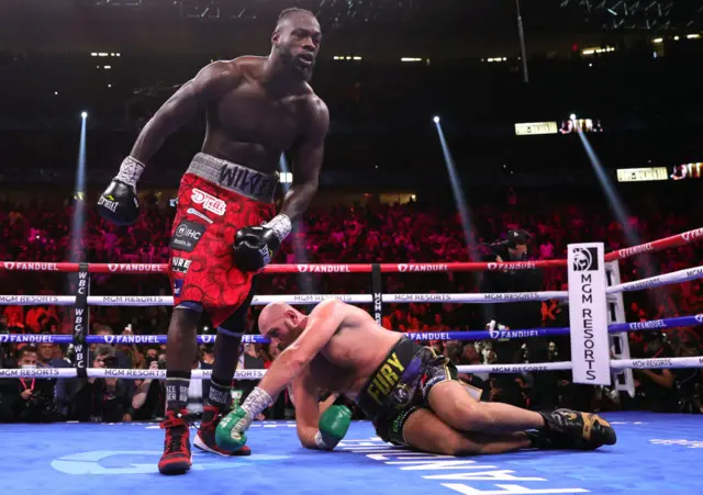 Tyson Fury is knocked down by Deontay Wilder for a second time