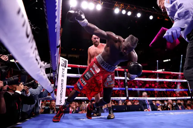 Tyson Fury knocks down Deontay Wilder to win the fight