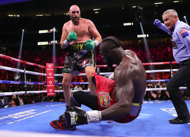 Tyson Fury knocks down Deontay Wilder
