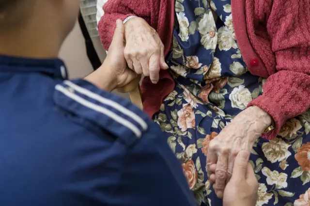 Stock pic of a carer and an elderly woman