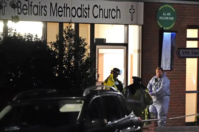 Forensics teams examine the scene of the stabbing in Leigh-on-Sea