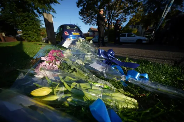 People lay flowers at the scene of the attack in Leigh-on-Sea