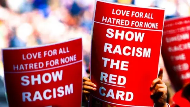 Show racism red card signs