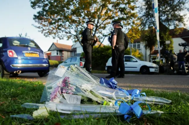 Flowers in tribute to Sir David Amess