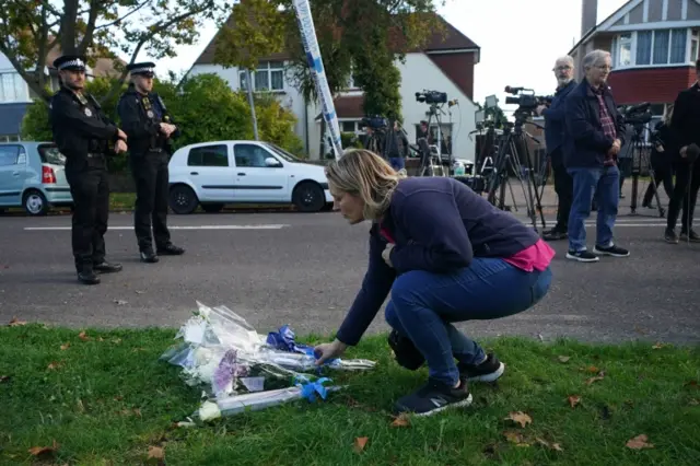 People lay flowers at the scene of the attack in Leigh-on-Sea