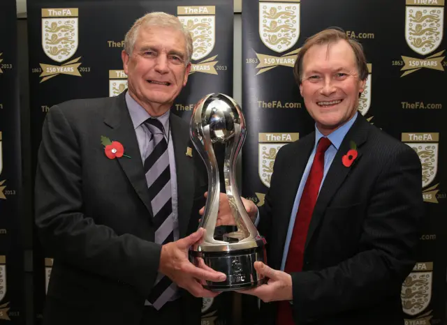 Sir David Amess with Trevor Brooking in 2015