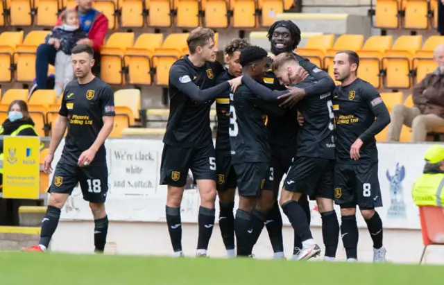 Livingston players celebrate Bruce Anderson's goal